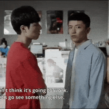 two young men are standing next to each other and one of them says " i dont think it 's going to work .