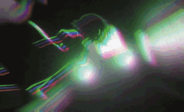 a blurry picture of a person holding a microphone