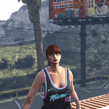 a woman standing in front of a billboard that says energy drink