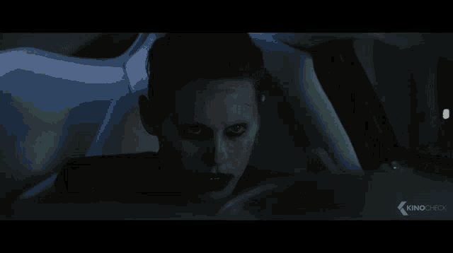a man in a joker costume is sitting in a white car