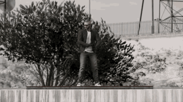 a man in a suit stands in front of a tree in a video game