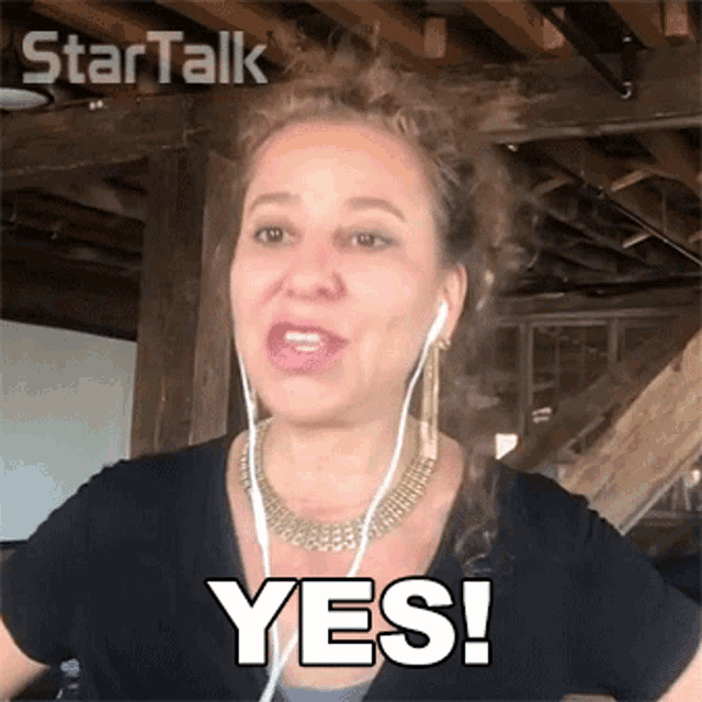 a woman wearing ear buds says yes in a star talk video