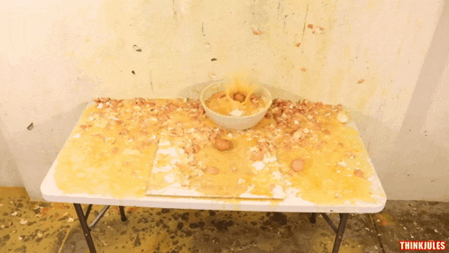 a white table with a bowl of food on it and think jules written on the bottom right