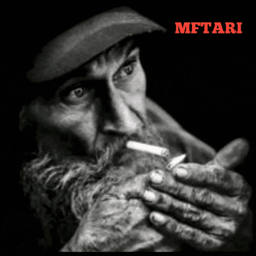 a man with a beard is smoking a cigarette in a black and white photo with the word mftari on the bottom