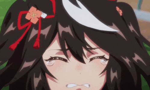 a close up of a girl with black hair and a flower in her hair