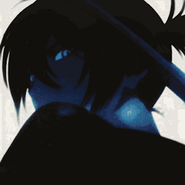 a close up of a person holding a sword in their hand