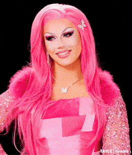 a woman with long pink hair is wearing a butterfly necklace