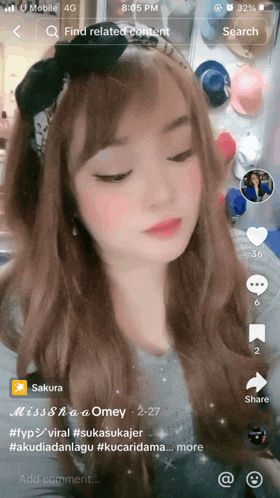 a screenshot of a woman 's face is displayed on a cell phone screen