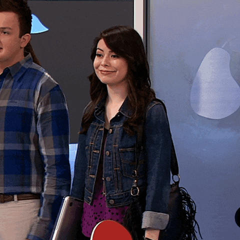 a woman in a denim jacket stands next to a man