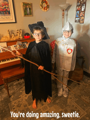 two children dressed in wizard of oz costumes with the words you 're doing amazing sweetie