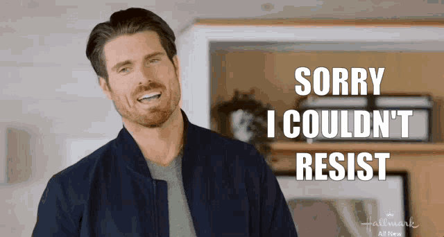 a man says sorry i couldn 't resist in front of a hallmark ad