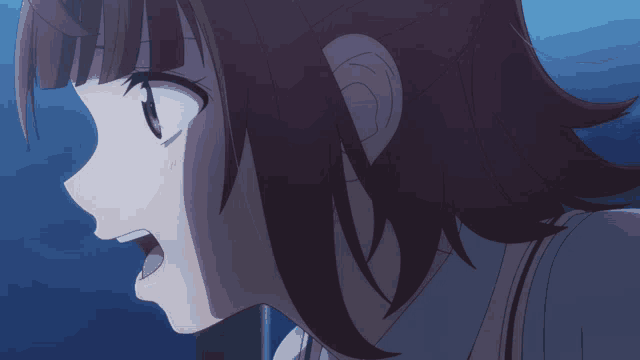 a close up of a person 's face with a surprised look on her face