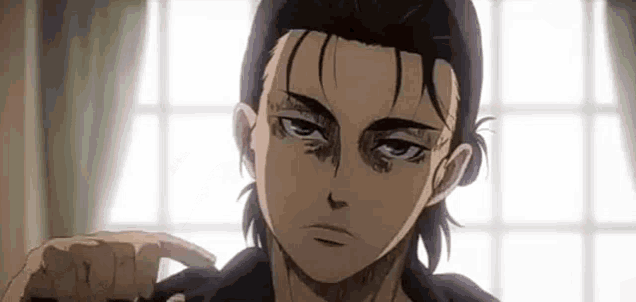 eren yeager from attack on titan is standing in front of a window and looking at the camera .