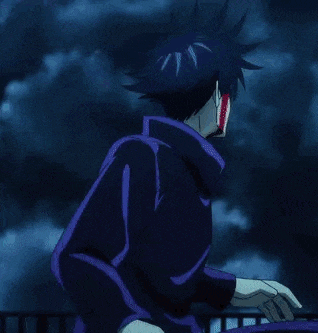 a man in a purple jacket is sitting on a balcony holding a cup of coffee .