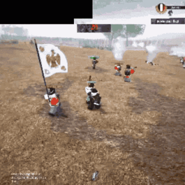 a group of soldiers are playing a video game and one of them is holding a flag with a bird on it