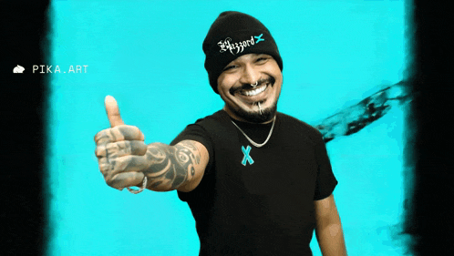 a man giving a thumbs up wearing a beanie that says blizzard