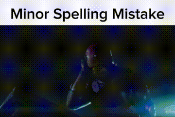 a man in a red helmet is sitting in a dark room with the words `` minor spelling mistake '' above him .