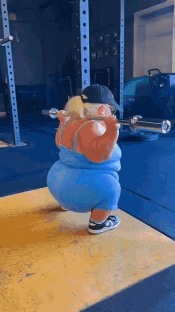 a cartoon of a woman squatting with a barbell