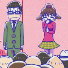 a man and a girl are standing next to each other in front of a crowd of people .