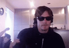 Norman Reedus Playing GIF - Norman Reedus Playing Action Figure GIFs