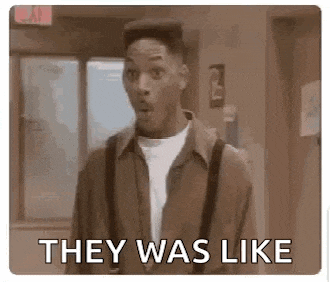 a man in a suit and suspenders is standing in a hallway and says `` they was like '' .
