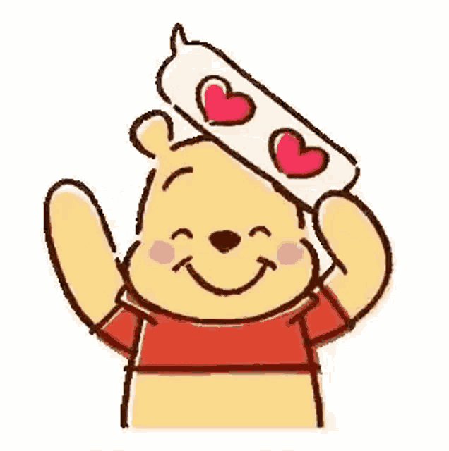 winnie the pooh is holding a speech bubble with hearts on it .