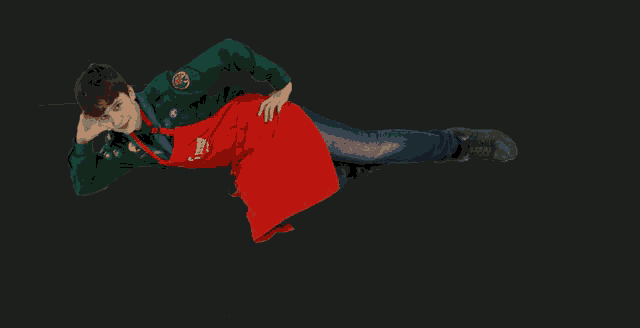 a person wearing a red apron that says ' volunteers ' on it