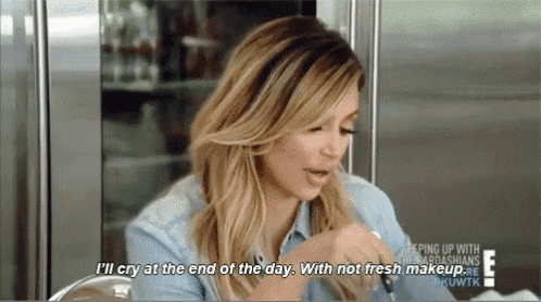 a woman is sitting at a table with her mouth open and saying `` i 'll cry at the end of the day .