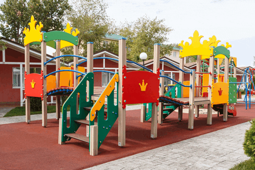 a colorful children 's playground with a crown on the top
