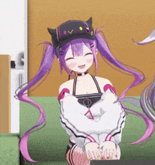 a girl with purple hair and pigtails is sitting on a green couch .