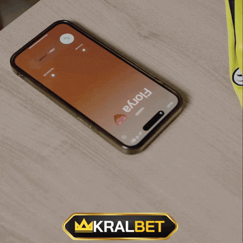 a phone with a time of 19:56 on the screen