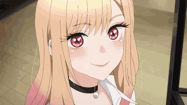 a girl with blonde hair and red eyes is smiling