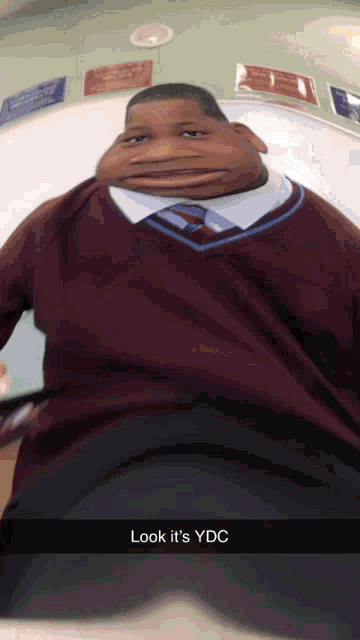 a snapchat of a man with a big face and the words look it 's ydc at the bottom