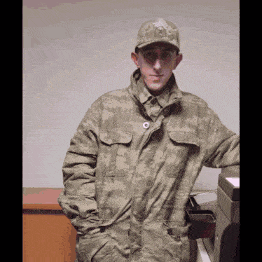 a man in a military uniform with a hat that says a on it