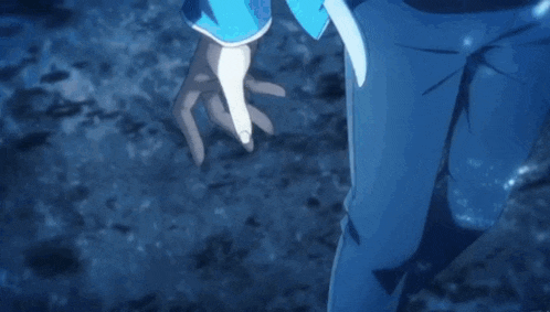 a person in a blue suit is standing in the water and holding a light .