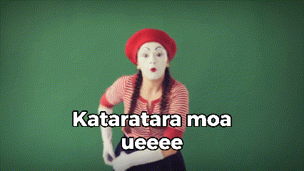 a woman wearing a mime mask and a red beret looks through her hands