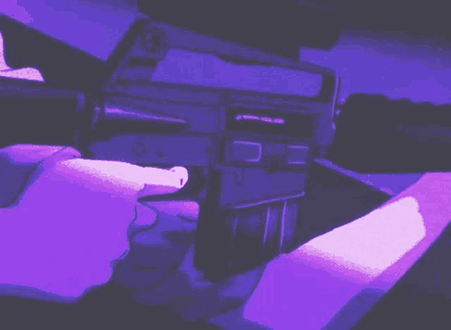 a person is holding a gun in their hand and pointing at it .