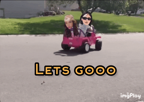 two women are driving a pink toy car with the words let 's gooo written on the bottom
