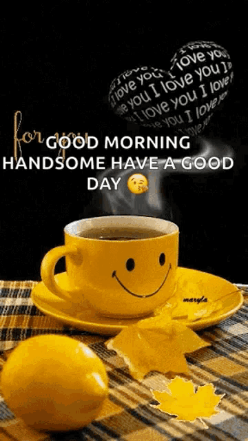 a cup of coffee with a smiley face on it is on a saucer next to a lemon