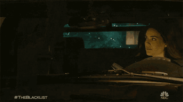 a nbc advertisement for the blacklist shows a woman looking out a window