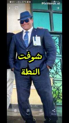 a man in a suit and hat with arabic writing