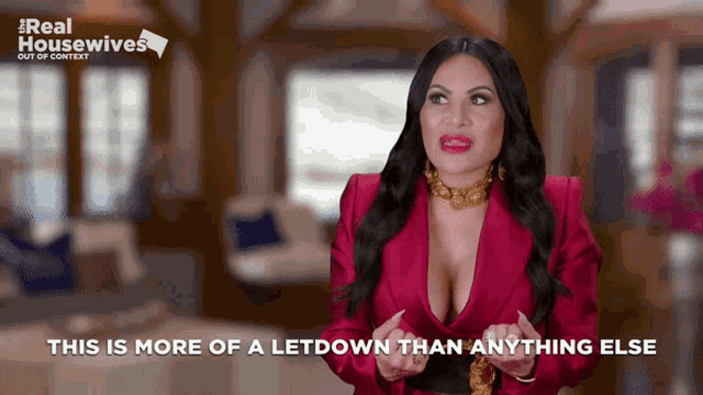 a woman in a red jacket with the words " this is more of a letdown than anything else " behind her
