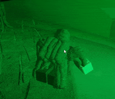 a computer screen with a green background and a cursor pointing to a statue