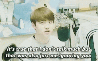 a young man is talking into a microphone and says it 's true that i don 't talk much but