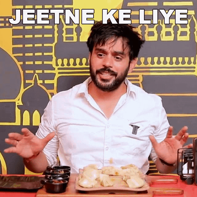 a man with a beard says jeetne ke liye in front of a tray of food