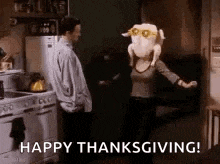 a man and a woman are dancing in a kitchen with a stuffed turkey on their heads .