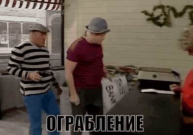 a man in a striped shirt is holding a sign that says ' bank '