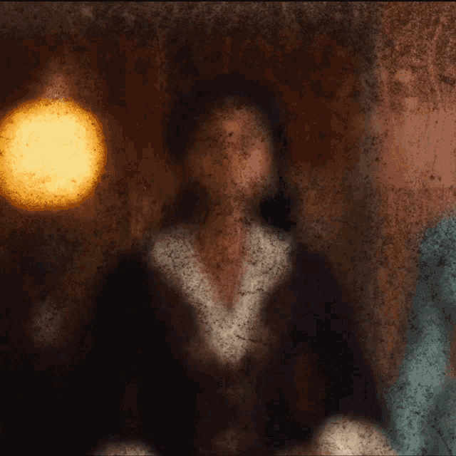 a woman says how do you do in a dark room