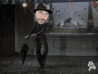 a man in a hat is dancing in front of a sign that says maholy