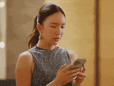 a woman is looking at her cell phone with justjaycee tumblr written on the bottom